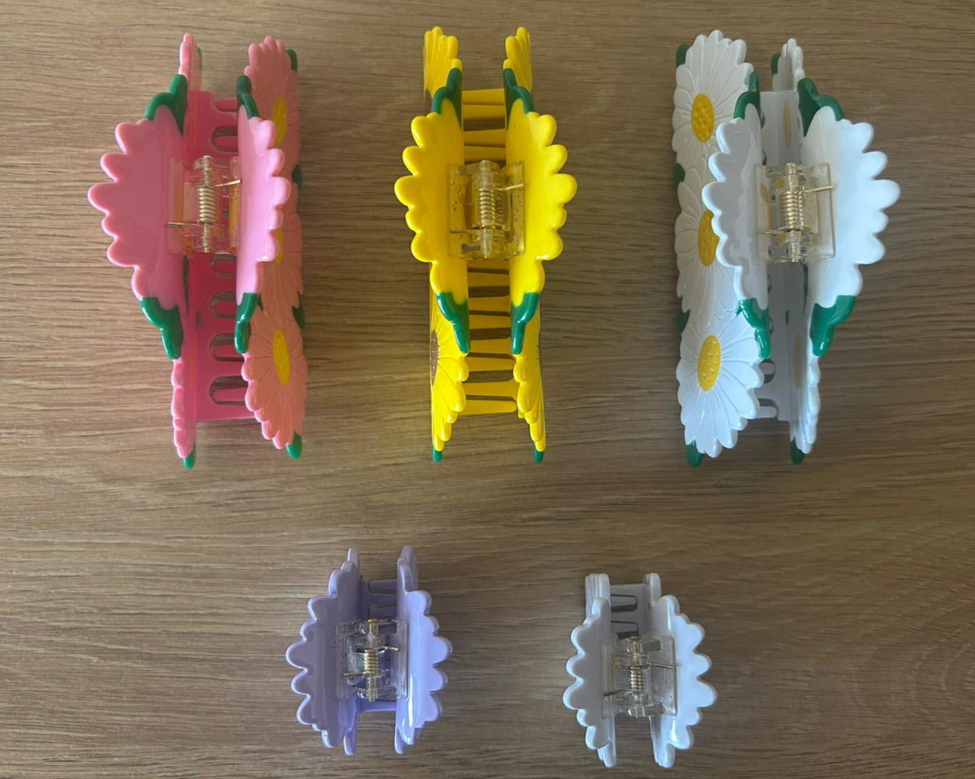 All Daisy Bunch Hair Claws Together Lying Straight Organized Next to One Another - Top View