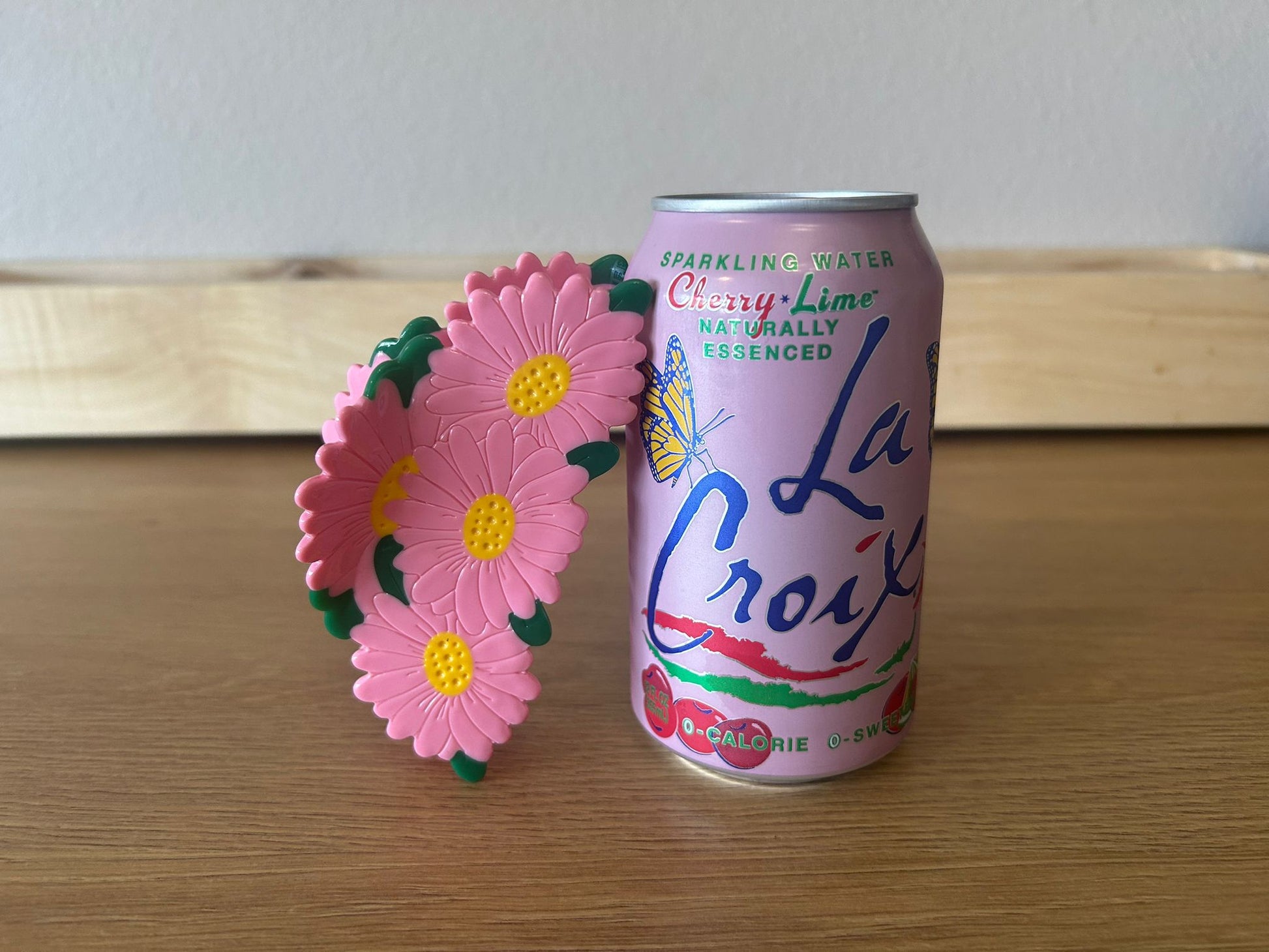 Maxi Pink Daisy - Size Comparions Front View - Resting Angled on Light Pink La Croix Soda Can